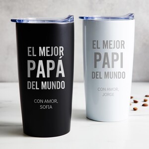 May include: Two insulated travel mugs, one black and one white, with silver text. The black mug reads "EL MEJOR PAPA DEL MUNDO" and "CON AMOR, SOFIA." The white mug reads "EL MEJOR PAPI DEL MUNDO" and "CON AMOR, JORGE."