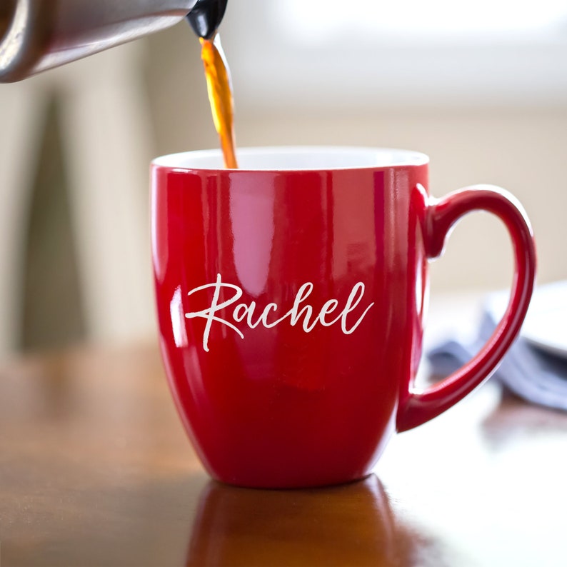 Coffee being poured into our personalized engraved oversized coffee mug with handle to the right customized with your name in your font choice.