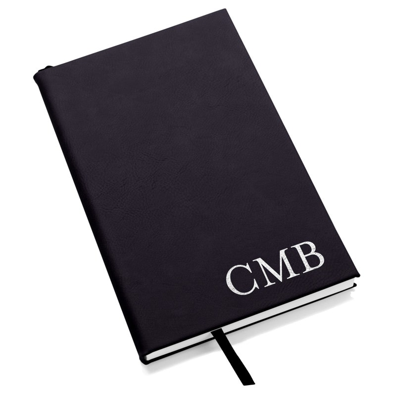 Create to-do lists and write down your ideas in a custom engraved monogrammed journal from Lifetime Creations. Shown in the color black.