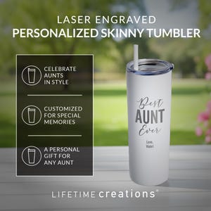 May include: A white laser-engraved skinny tumbler with a clear lid and straw. The text reads: LASER ENGRAVED PERSONALIZED SKINNY TUMBLER, CELEBRATE AUNTS IN STYLE, CUSTOMIZED FOR SPECIAL MEMORIES, A PERSONAL GIFT FOR ANY AUNT, Best AUNT Ever, Love, Violet.