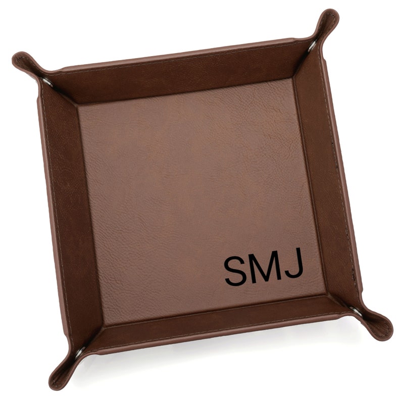Our monogrammed catchall valet tray by Lifetime Creations is the perfect place for them to drop their keys, change, cash, or other knick-knacks when they get home. Engraved with your recipient's initials, the tray makes an impressive gift.