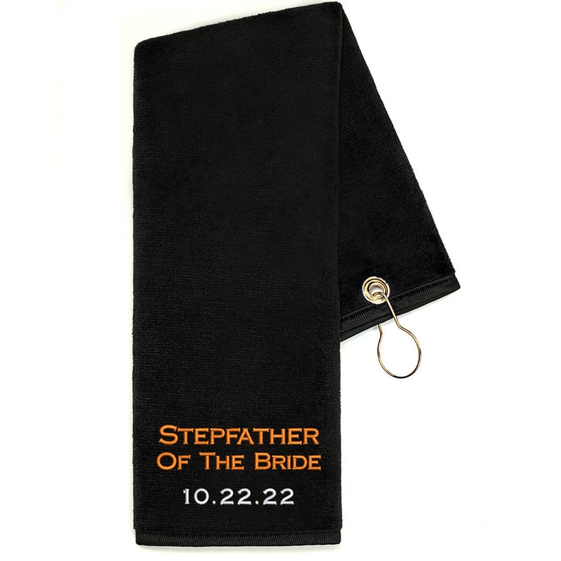 Custom Golf Towel in black embroidered with Stepfather of the Bride in orange thread and the wedding date in white thread.
