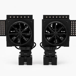 May include: Two black modular cooling units, each featuring a central circular fan, a top row of small LED lights, and a side-mounted rectangular panel containing a grid of individual light-emitting diodes, all mounted on adjustable base brackets.