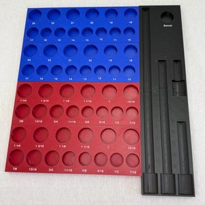 May include: A multi-tiered storage organizer featuring blue and red plastic trays with circular cutouts labeled with numerical sizes, alongside a black vertical tray labeled Swivel. The blue section displays numbers 10 through 24, while the red section displays fractional inch measurements from 7/16 to 1 1/4.