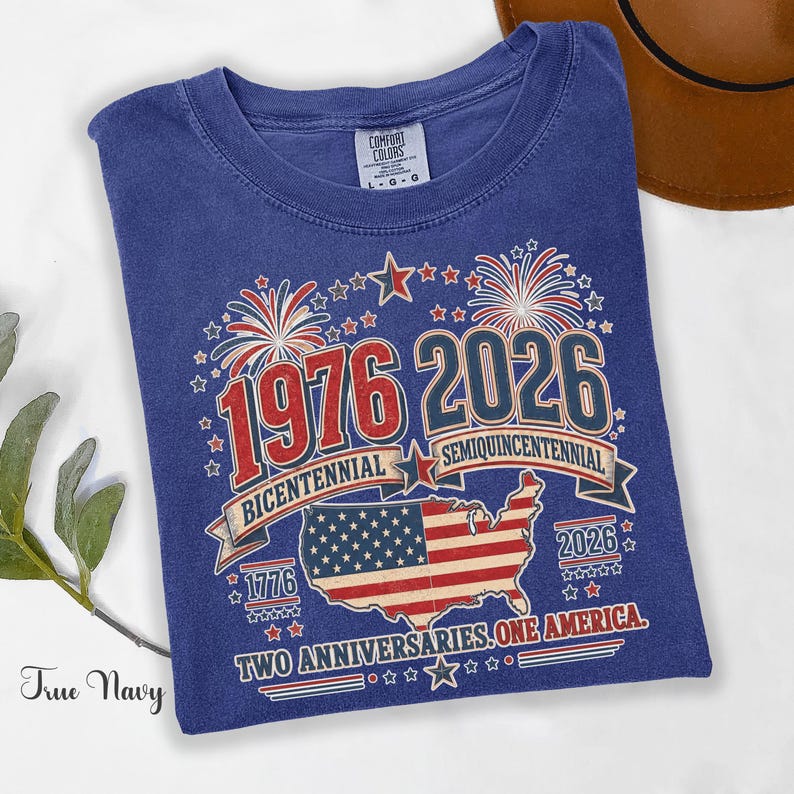 True Navy Comfort Colors t-shirt featuring a vintage patriotic 1976 Bicentennial vs 2026 Semiquincentennial design with bold 1776–2026 text, American flag graphic, fireworks, and USA map, worn as a stylish patriotic outfit for Independence Day, July 4th celebrations, USA 250th anniversary events, and perfect as a 1976 birthday gift or turning 50 t-shirt for those proud of American history and heritage