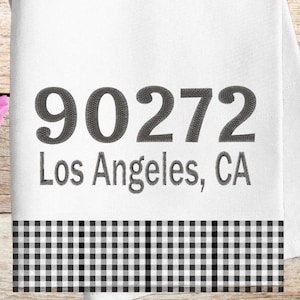 May include: White kitchen towel with a black and white checkered border. The towel has the text "90272 Los Angeles, CA" embroidered in black.