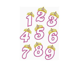 May include: Pink numbers 1 through 9 with gold crowns on top. The numbers are outlined in pink and the crowns have white jewels.