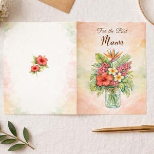 May include: A watercolour greeting card featuring a floral design. The card is open, displaying a bouquet of flowers in a glass jar. The text "For the Best Maam" is on the right. The left side has a small floral design.