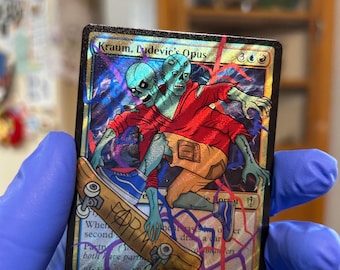 May include: A holographic trading card titled Kraum, Ludevic's Opus featuring a two-headed zombie character in a red hoodie and tan shorts riding a skateboard. The card has a black border, blue and red lightning-like accents, and a 4/4 power rating.