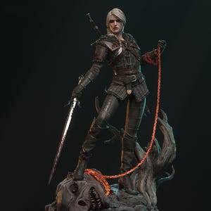 May include: A detailed statue of a female warrior in dark armor, holding a sword and a chain. She stands atop a monster, with a Witcher medallion on the base. The statue has intricate details and a dynamic pose, with a dark background.