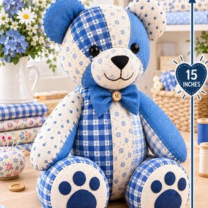 May include: A patchwork teddy bear crafted from blue and white fabric with floral and gingham patterns. The bear features a blue bowtie with a central wooden button, black button eyes, and dark blue paw pads. A vertical arrow indicates a height of 15 inches.
