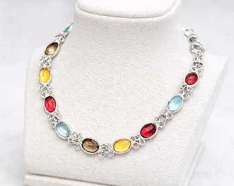 Armband van 925 sterling zilver met veelkleurige edelstenen, ovale zetting met citrien, granaat, blauwe topaas en rookkwarts.