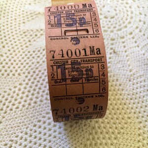 May include: Three vintage paper tickets for Chester City Transport. The tickets are brown with black text and numbers. The tickets are numbered 74000 Ma, 74001 Ma, and 74002 Ma. The tickets are issued subject to bye-laws and regulations.