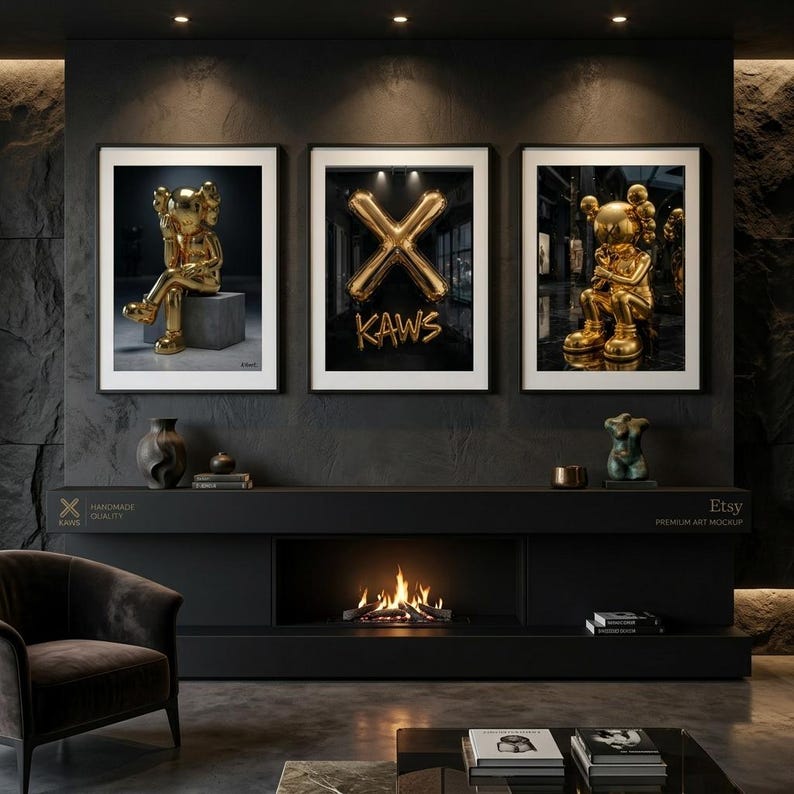 May include: Three framed art prints showcasing gold KAWS sculptures and a gold balloon X with the word "KAWS". The prints are displayed above a black fireplace with a burning fire.