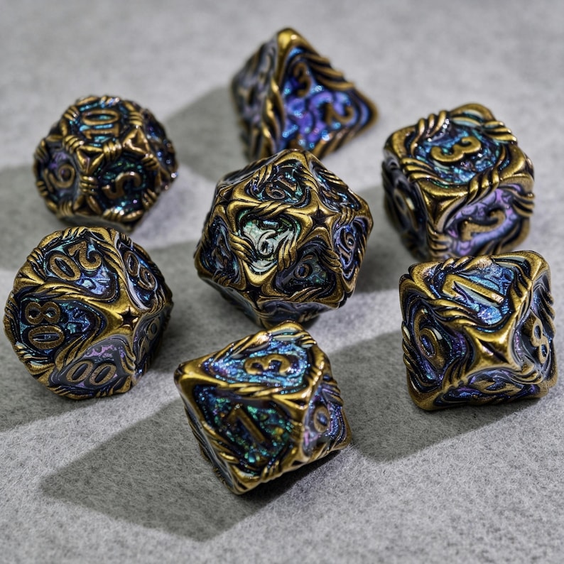 May include: A collection of seven polyhedral dice with a metallic gold finish and blue and purple iridescent accents. The dice are designed with intricate patterns and numbers, suitable for tabletop gaming.