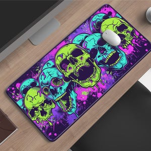 May include: A trio of ceramic mugs with a speckled, matte finish in cream, light grey, and dark grey. Each mug features a minimalist design and a rounded handle.