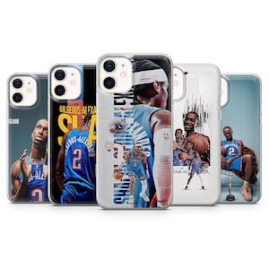 May include: A selection of transparent phone cases, each displaying a basketball player in a blue and orange uniform. The cases feature action shots and player names. The cases are designed for different phone models.