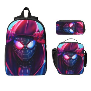 May include: A black backpack, pencil case, and lunch bag set featuring a superhero design. The design includes a character in a red and black hooded outfit with blue and pink eyes. The backpack has a top handle and adjustable straps.