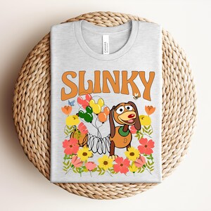 Retro Slinky Dog T-Shirt, Vintage Floral Toy Story Tee, Mickey Balloon Aesthetic Gift for Theme Park Fans Bild 2