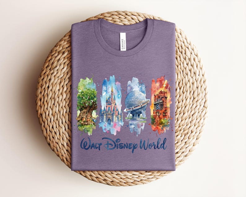 May include: A purple t-shirt featuring watercolor illustrations of iconic Walt Disney World landmarks: the Tree of Life, Cinderella Castle, Spaceship Earth, and the Tower of Terror. The words "Walt Disney World" are written in a script font below the images.