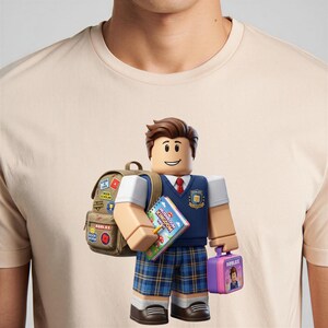 May include: A beige t-shirt featuring a graphic of a Roblox character dressed in a school uniform. The character wears a blue vest, plaid shorts, and carries a tan backpack with patches, a notebook labeled Mushroom Kingdom High, and a purple lunchbox.