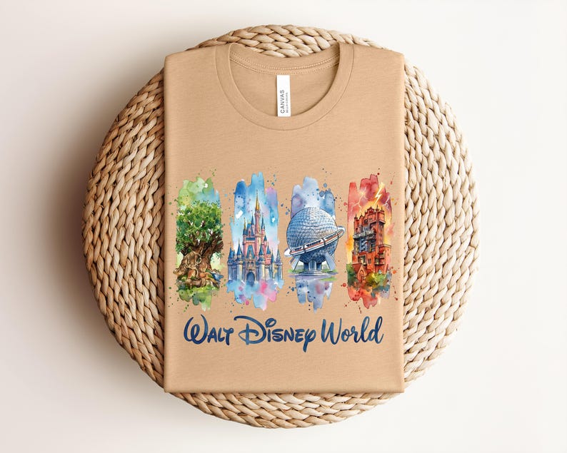 May include: Tan t-shirt featuring watercolor illustrations of iconic Walt Disney World landmarks: the Tree of Life, Cinderella Castle, Spaceship Earth, and the Tower of Terror. The words "Walt Disney World" are written in a blue script font.