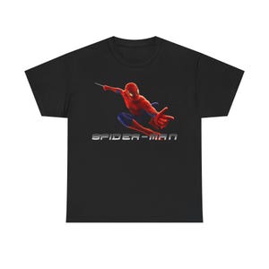 A black t-shirt with a graphic of Spider-Man in action, along with the text "SPIDER-MAN" printed on it.