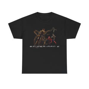 A black t-shirt with a graphic design featuring characters from the Spider-Man franchise, including Spider-Man, Spider-Man 2, and another character.