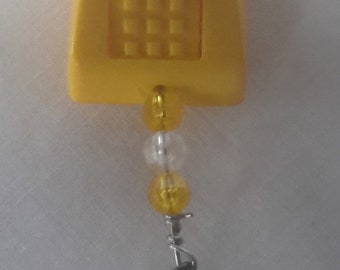 Plastic yellow pushbutton telephone humorous fishing lure novelty bait for tackle box or fishermans gag gift NOT vintage