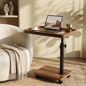 May include: A height-adjustable rolling side table with a dark wood-grain finish top and base, supported by a black metal central column. The table features a knob for height adjustment and four small wheels, holding a tablet, a cup, and a small object.