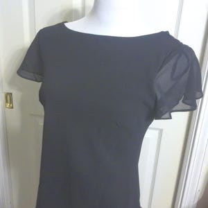 Timeless Classic LBD Black Chiffon Size 6 Short Sleeve Dress with elegant cowl back and decorative hand beaded floral embellishment in front