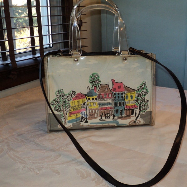 Vintage French Street Scene Handbag, protected by a thick plastic cover along with clear vintage plastic handles