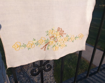 Vintage Pure Linen Hand Embroidered Table Runner or Tea Towel w/ an elegant yellow floral design display wrapped in a stitched brown ribbon