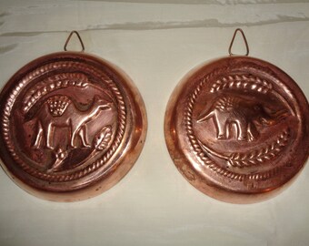2 Solid Copper Cooking Molds with Zinc Lining of relief images of an Elephant and A Camel in an elegant Indian design with developed patina