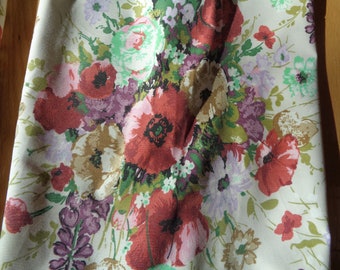 Four (4) Floral Chintz Pleated Drapery Panels that are lined with a vinyl like rubber polyester lining in Vintage Condition
