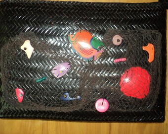 SOMETHING'S FISHY, A Retro Black Straw Hand Bag Clutch with black fishing net with various fishes and shells in the Net in Good Condition