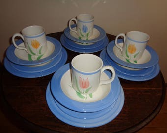 16 Piece Hand Painted Blue and White Dish Set with a painted tulip design on each piece in Mint Condition, Made in Italy, in original box