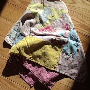 Vintage Baby Quilt, A  Crazy quilt style blanket made with wonderful vintage nursery fabrics for a doll's crib or more