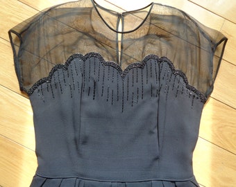 Vintage Classic LBD, A  Beautiful Black Silk Dress with Peplum waist and exquisite beading on sheer black chiffon neckline.