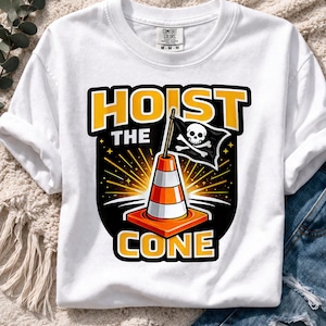 May include: White t-shirt with a graphic featuring a traffic cone with a pirate flag and the words "HOIST THE CONE" in yellow and black. The shirt has a crew neck and short sleeves.