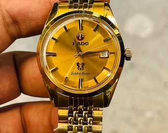 Reloj Rado Golden Horse vintage automático con esfera dorada y efecto sol, acero inoxidable y fecha para hombre