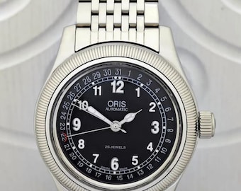 Reloj Oris vintage automático con corona grande, esfera negra, acero inoxidable, fabricado en Suiza, para hombre.