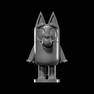 May include: A monochromatic gray figurine of a cartoon dog character with tall pointed ears, large oval eyes, and a rounded snout. The figure stands on a small circular base, featuring a smooth surface with visible seams along the arms and torso.