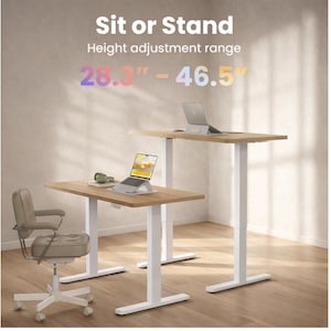 May include: Two height-adjustable desks with light wood tops and white legs. The text "Sit or Stand" and "Height adjustment range" are at the top. The height adjustment range is 28.3" - 46.5". A beige office chair and two laptops are also visible.