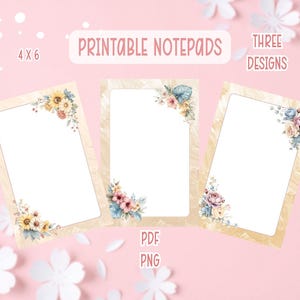 May include: Three printable notepads, each with a floral corner design. The notepads are 4 x 6 inches and feature different floral arrangements in shades of yellow, pink, and blue. The text "Printable Notepads" and "Three Designs" are displayed.