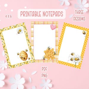 May include: Three printable notepads with bee and daisy designs. The notepads are 4 x 6 inches and feature a white background with decorative borders. The image includes the text "Printable Notepads", "Three Designs", "PDF", and "PNG".
