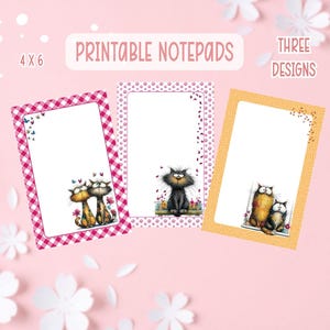 May include: Printable notepads with three designs, each featuring a different cat illustration. The notepads are 10 x 15 cm, with a white interior and decorative borders in pink and yellow. The text "Printable Notepads" is displayed.