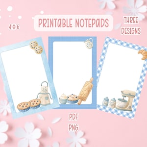 May include: Three printable notepads with baking-themed designs. Each notepad has a white interior with a light blue border. The designs include cookies, a rolling pin, and a mixer. The text "Printable Notepads" is at the top.