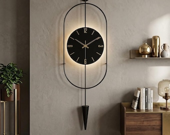 Large Metal Wall Clock with Pendulum, Battery Operated LED Backlit Modern Wall Art, Silent Scandinavian Decor, Black Oval Luxury Clock