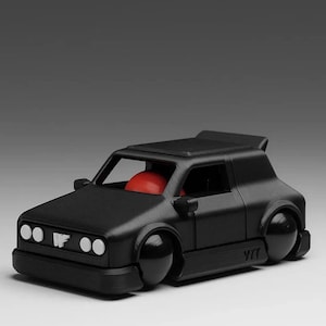 May include: A matte black toy car with a red interior. The car has a spoiler, white headlights, and the letters "WF" on the front. The wheels are black and rounded. The car is a miniature model.